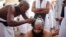 A Muslim pilgrim has his head shaved after casting pebbles at a pillar that symbolizes Satan during the annual haj pilgrimage, on the first day of Eid al-Adha in Mina, near the holy city of Mecca, Oct. 15, 2013. 