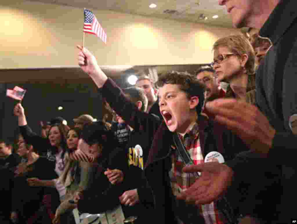 A young supporter of Republican presidential candidate Ron Paul celebrates at Paul's New Hampshire primary night rally in Manchester, New Hampshire, January 10, 2012. (Reuters)