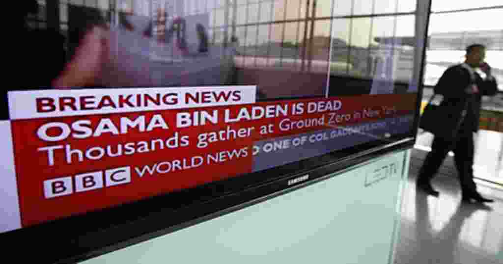 A South Korean man walks past a TV screen showing news that a U.S.-led operation had killed al Qaeda leader Osama bin Laden, at Seoul railway station in Seoul May 2, 2011. U.S. forces finally found al Qaeda leader Osama bin Laden not in the rugged mountai