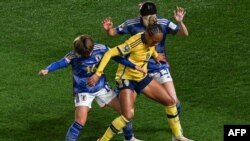 Japan's midfielder #16 Honoka Hayashi, Sweden's forward #07 Madelen Janogy and Japan's midfielder #13 Jun Endo compete for the ball during the Australia and New Zealand 2023 Women's World Cup quarterfinal match between Japan and Sweden at Eden Park in Auckland, Aug.11, 2023.