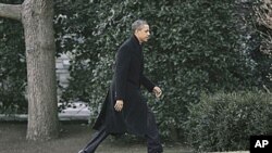 President Barack Obama walks back to the Oval Office of the White House in Washington, where he was scheduled to meet with members of his National Security team to discuss the events in Egypt, February 10, 2011