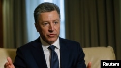 FILE - Kurt Volker, former U.S. Special Representative for Ukraine Negotiations, gestures during an interview in Kyiv, Oct. 28, 2017.