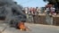 Anti-government protesters set fire during clashes with Guinea security forces in Conakry, Feb. 27, 2013.