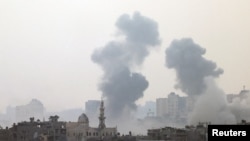 FILE - Smoke is rising after an Israeli strike on Gaza seen from a viewpoint in Southern Israel October 24, 2023. 