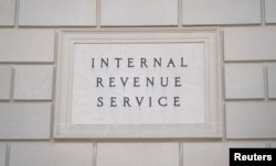 A sign is seen at the US Internal Revenue Service (IRS) building after it was reported the IRS will lay off about 6,700 employees, in Washington, Feb. 20, 2025.