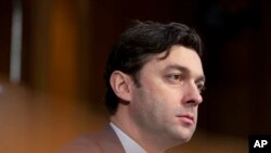 FILE - Sen. Jon Ossoff, D-Ga., listens during a Senate Intelligence Committee hearing to examine worldwide threats at the Capitol in Washington, March 8, 2023.
