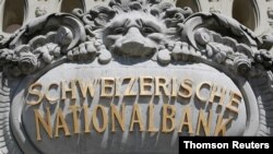 FILE - A Swiss National Bank logo is pictured on the SNB building in Bern, Switzerland, May 20, 2020.