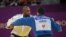 Teddy Riner, en blanc, face à Gela Zaalishvili de la Georgie dans la catégorie des +100kg à Doha, Qatar, le 13 janvier 2021. (Photo by - / AFP)