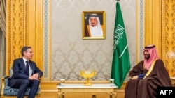 FILE - This handout picture provided by the Saudi Press Agency (SPA) shows Saudi Arabia's Crown Prince Mohammed bin Salman (R) receiving US Secretary of State Antony Blinken (L) in Riyadh on February 5, 2024. 