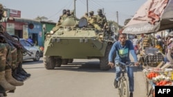 A Zambian Army armored personnel carrier patrols the Chawama Compound in Lusaka on August 3, 2021, after President Edar Lungu ordered the army to help police curb political violence in the run-up to the August 12 elections.