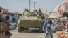 FILE - A Zambian Army armored personnel carrier patrols the Chawama Compound in Lusaka, Aug. 3, 2021, after President Edgar Lungu ordered the army to help police curb political violence in the run-up to the Aug. 12 elections.