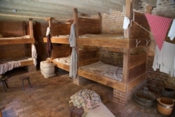 Reconstruction of the men's bunkroom in the greenhouse slave quarters at Mount Vernon in Alexandria, Virginia. (Courtesy George Washington's Mount Vernon)