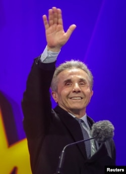 Bidzina Ivanishvili, founder of the Georgian Dream party, waves during a final campaign rally held by the party's supporters ahead of the upcoming parliamentary elections in Tbilisi, Oct. 23, 2024.