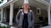 Rebecca Wood stands outside her home in Maynard, Massachusetts, Aug. 30, 2024. Wood noticed she was being charged a "program fee" each time she loaded money onto her daughter's school lunch account. 