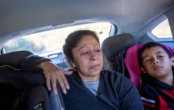 Maria Campos, 52, approaches the Stewart Detention Center with her grandkids to visit her son, in Lumpkin, Ga., Nov. 10, 2019.