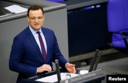 FILE - German Health Minister Jens Spahn speaks at the lower house of parliament Bundestag on the start of the coronavirus vaccinations, in Berlin, Germany, Jan. 13, 2021.