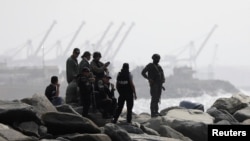 FILE - Members of a special forces unit are seen at a shore, after Venezuela's government announced a failed "mercenary" incursion, in Macuto, Venezuela, May 3, 2020. 