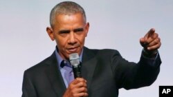 Former President Barack Obama addresses the crowd as the last speaker at final session of the Obama Foundation Summit in Chicago, Nov. 1, 2017.