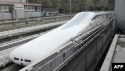 The Central Japan Railway Co.'s seven-car 'magnetic levitation' or maglev train returns to the station after setting a new world speed record in a test run near Mount Fuji, April 21, 2015. 