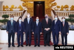 U.S. Secretary of State Mike Pompeo poses for a photo with Vietnam's Prime Minister Nguyen Xuan Phuc after their meeting at the Government Office in Hanoi, Vietnam, Oct. 30, 2020.