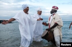 Members of the Africa Queen Mothers participate in a sunrise service and spiritual cleansing ceremony in remembrance of the 400-year anniversary of the arrival of the first enslaved Africans in Virginia, in Hampton, Va., Aug. 24, 2019.