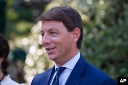 Deputy White House press secretary Hogan Gidley walks back to the West Wing after a television interview at the White House, Tuesday, Aug. 6, 2019, in Washington.