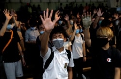 Anti-government protesters gather outside the venue of the first community dialogue held by Hong Kong Chief Executive Carrie Lam in Hong Kong, Sept. 26, 2019.