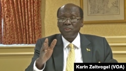 South Sudan Foreign Minister Barnaba Marial Benjamin, shown here at a news conference in Washington, D.C. on Dec. 4, 2014, says the year-long conflict in South Sudan has not affected oil production.