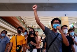 With access to the airport restricted, protesters shout slogans at a shopping mall in Hong Kong, Sept. 7, 2019.