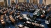 In this image from video, senators vote on the first article of impeachment during the impeachment trial of President Donald Trump, in the Senate at the U.S. Capitol in Washington, Feb. 5, 2020. 