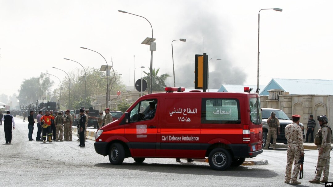 An ambulance arrives at the scene of a bomb attack in Baghdad, March 14, 2013.