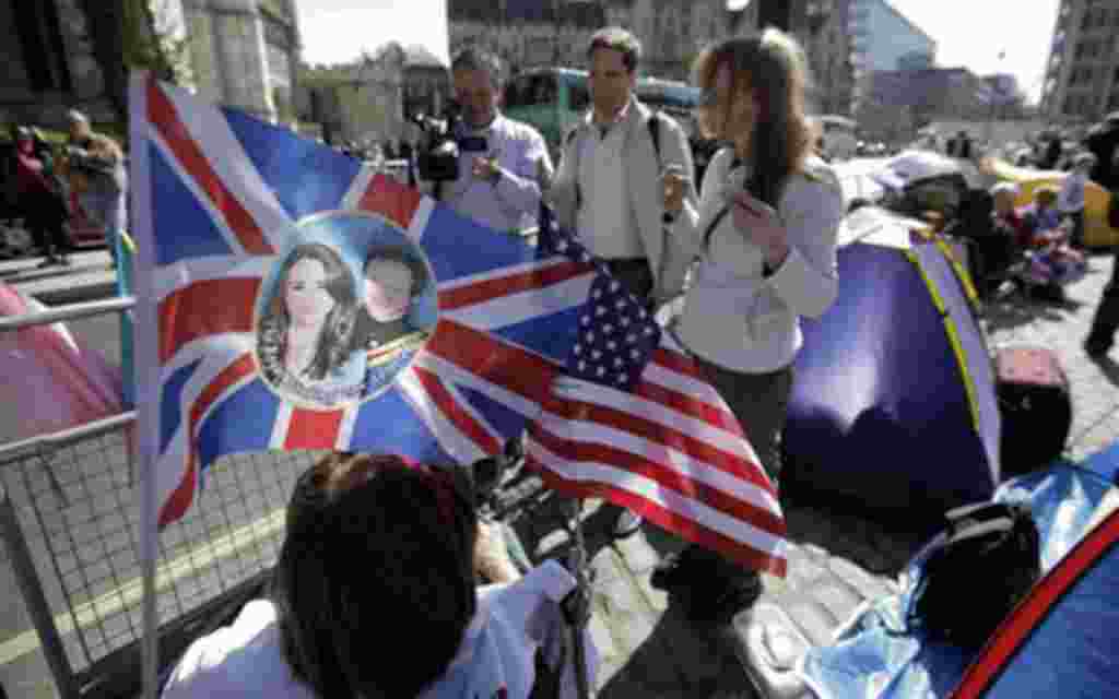 Royal enthusiasts camp across the road from Westminster Abbey in order to ensure the best viewing spots for themselves, ahead of Friday's royal wedding, in central London, Wednesday, April 27, 2011. Britain's Prince William and Kate Middleton will wed on 