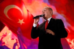 Turkish President Erdogan addresses his supporters during a ceremony marking the third anniversary of the attempted coup at Ataturk Airport in Istanbul, July 15, 2019.