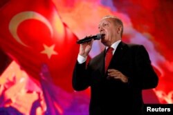 Turkish President Erdogan addresses his supporters during a ceremony marking the third anniversary of the attempted coup at Ataturk Airport in Istanbul, July 15, 2019.