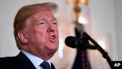 President Donald Trump speaks in the Diplomatic Reception Room of the White House on, April 13, 2018, in Washington, about the United States' military response to Syria's April 7 chemical weapons attack.