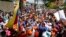 Opposition leaders Juan Guaido, center left, and Freddy Superlano, greet supporters during a demonstration in support of Superlano in Barinas, Venezuela, Dec. 4, 2021.