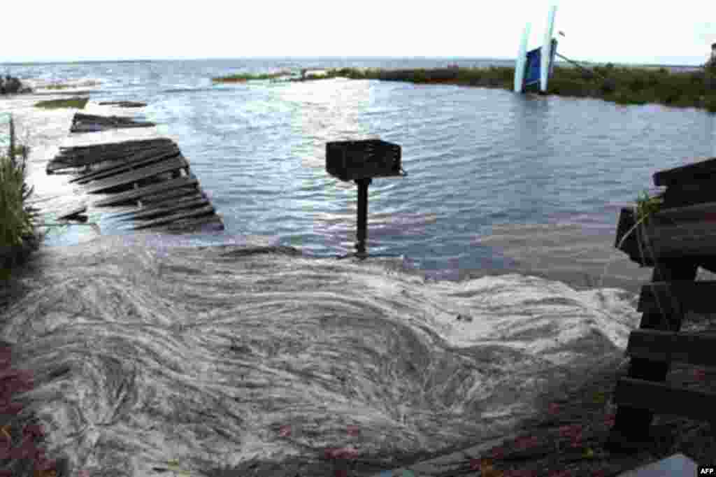 Debris from Hurricane Irene collects in the water at Whalebone Sound near Nags Head, N.C., Sunday, Aug. 28, 2011. Initial reports suggested light damages in many areas from Irene, a lower-strength hurricane when it struck the U.S. (AP Photo, Robert Ray)