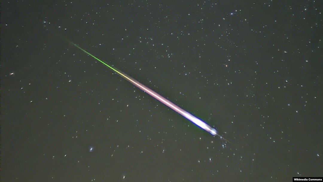 FILE - A meteor of the Leonid meteor shower. The photograph shows the meteor, afterglow, and wake as distinct components.