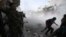 Free Syrian Army fighters run for cover after Syrian forces fired a mortar in the El Amreeyeh neighborhood of Syria's northwestern city of Aleppo August 30, 2012.