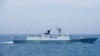 A Chinese naval Z-9 helicopter prepares to land aboard the PeopleÕs Liberation Army (Navy) frigate CNS Huangshan (FFG-570) as the ship conducts a series of maneuvers and exchanges with the Arleigh Burke-class guided-missile destroyer USS Sterett …