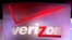 FILE - A Verizon sign is seen displayed at an electronics show.