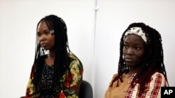 FILE—Jummai Mutah, left, and Amina Ali, right, Chibok schoolgirls who were kidnapped in 2014 by Islamic extremists and later released, attend a 10th anniversary event of the abduction in Lagos, Nigeria, April 4, 2024.