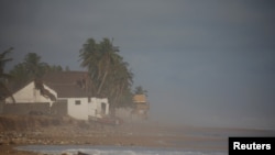 A sudden rise in water level damages hotels and houses in the coastal towns east of Abidjan