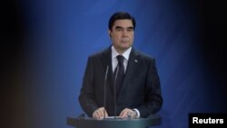 FILE - President of Turkmenistan Kurbanguly Berdymukhamedov attends a news conference in Berlin, Germany, Aug. 29, 2016.