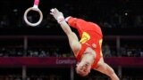 Chinese gymnast Chen Yibing performs on the rings during the Artistic Gymnastic men&#39;s team final, July 30, 2012.