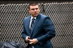 New York City police officer Daniel Pantaleo leaves his house, May 13, 2019, in Staten Island, N.Y.