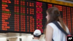 A departure flight board displays various canceled and delayed flights in Ben Gurion International airport a day after the U.S. Federal Aviation Administration imposed a 24-hour restriction on flights to the airport in Tel Aviv, Israel, July 23, 2014. 