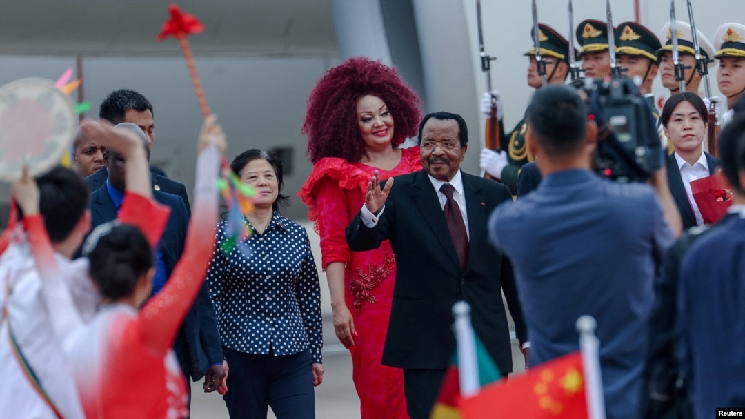 FILE - Cameroon's President Paul Biya, center, waves as he arrives at the Beijing Capital International Airport, ahead of the 2024 Summit of the Forum on China-Africa Cooperation (FOCAC) in Beijing, China, Sept. 4, 2024. 