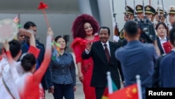 FILE - Cameroon's President Paul Biya, center, waves as he arrives at the Beijing Capital International Airport, ahead of the 2024 Summit of the Forum on China-Africa Cooperation (FOCAC) in Beijing, China, Sept. 4, 2024. 