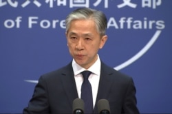 FILE - Chinese Foreign Ministry spokesman Wang Wenbin speaks during a press conference in Beijing, Nov. 13, 2020.